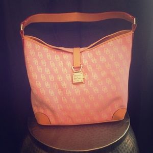 A pink/tan Dooney and Bourke purse.